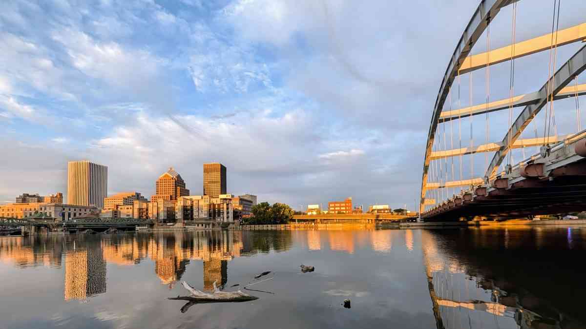 Rochester, New York skyline reflected in the Genesee River during golden hour